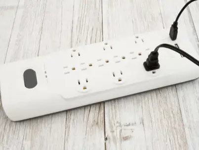 A white surge protector with multiple outlets